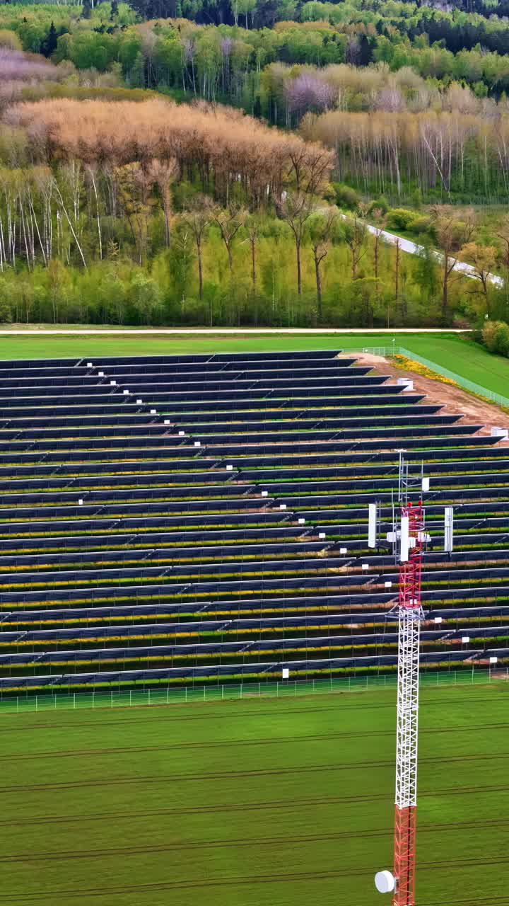 Vertical View Of Solar Power For Telecommunication Tower In Countryside Fields.