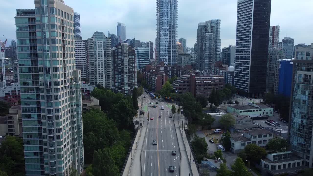 Aerial View of a Bustling Cityscape with Tall Buildings and a Busy Road