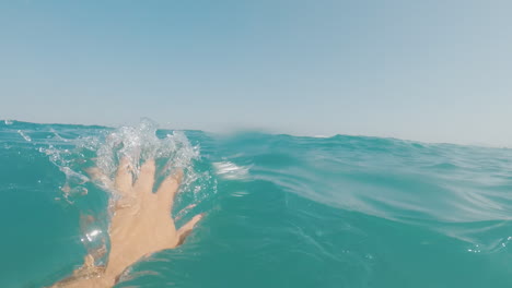 the hand of a man in need of help in the sea rescue the drowning