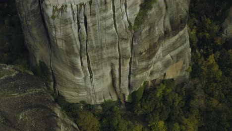 aerial view over the varlaam cloister, in meteora, greece - tilt, drone shot