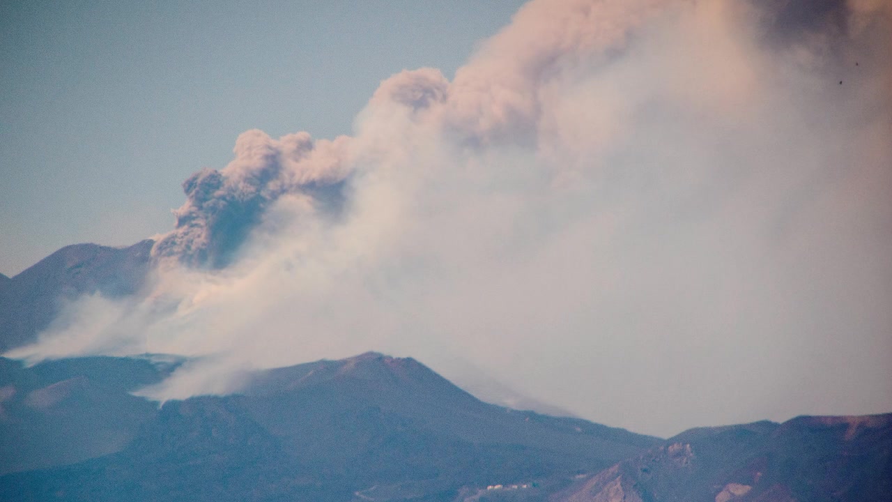 Mount Etna, one of the most active volcanos in the world. Here it is seen with ash clouds emitting from it just after it errupts. On the island of Sicily, Italy.