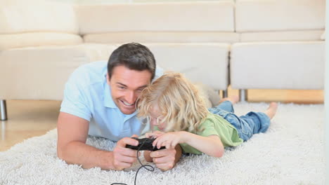 son grabbing the joystick from his father hands