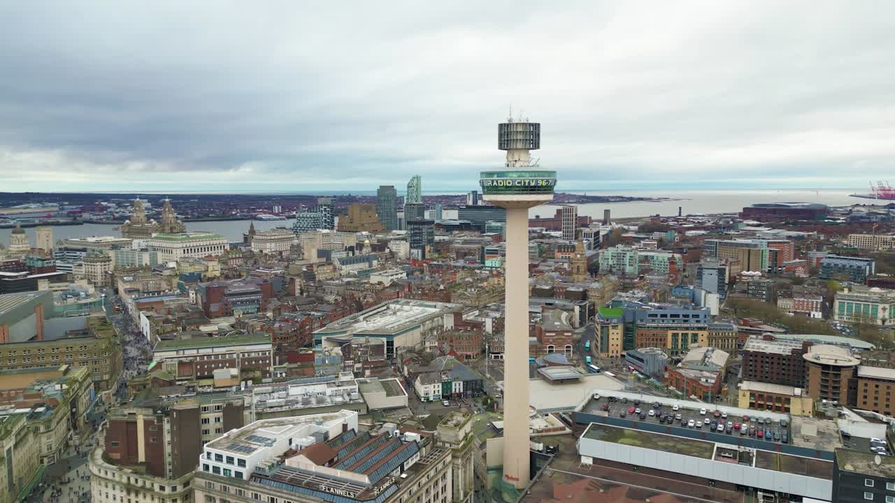 Video cityscape view of Liverpool city centre featuring the iconic Radio City Tower. The urban scene showcases modern and historic architecture with the tower standing tall above the skyline