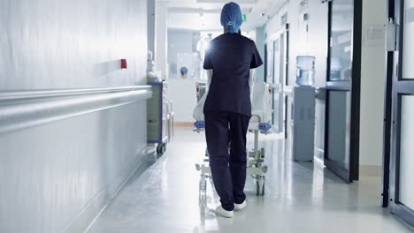 Patient,-bed-and-nurse-walking-in-hospital