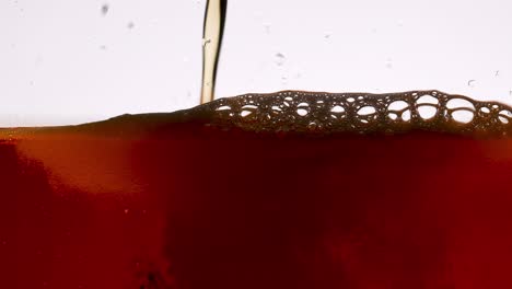 pouring dark beer