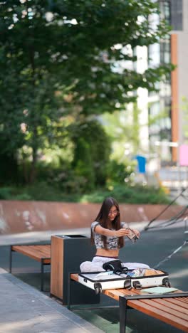 teenage girl using phone outdoors