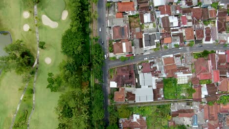 abstract pattern of residential district and golf course in magelang, indonesia aerial top down