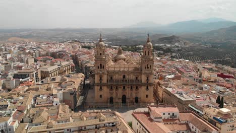 Spain-Jaen-Cathedral,-Catedral-de-Jaen,-flying-shoots-of-this-old-church-with-a-drone-at-4k-24fps-using-a-ND-filter-also-it-can-be-seen-the-old-town-of-Jaen