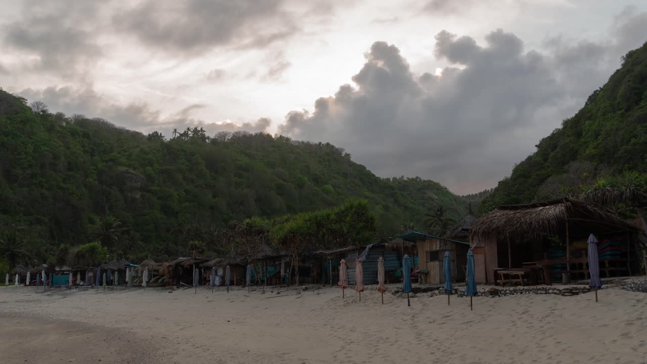 Beach Scene at Sunset with Mountain and Hut