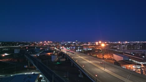 aerial view of coors field at twilight, surrounded by city lights, highlighting the stadium architecture
