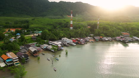 aerial view of northern koh lanta coast with old town houses and boats, thailand