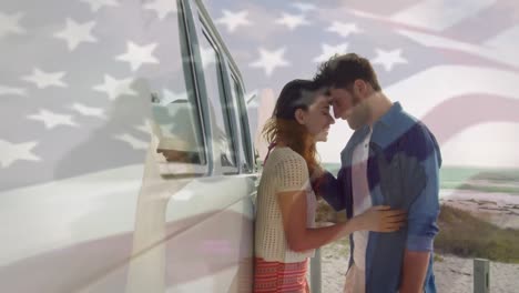 Animation-of-waving-flag-of-usa-over-couple-having-fun-on-the-beach