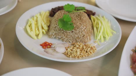 vietnamese fried rice next to pomelo salad served in table