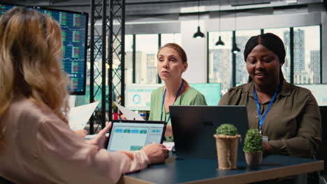 vertical video businesswoman concentrates on business strategy reviewing insights