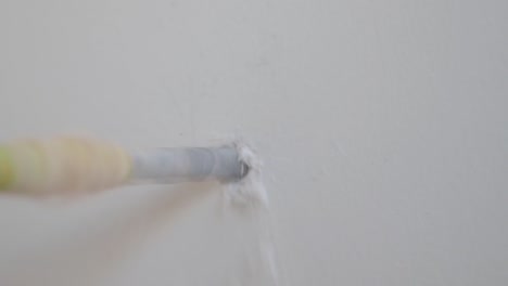 drilling a hole in a wall