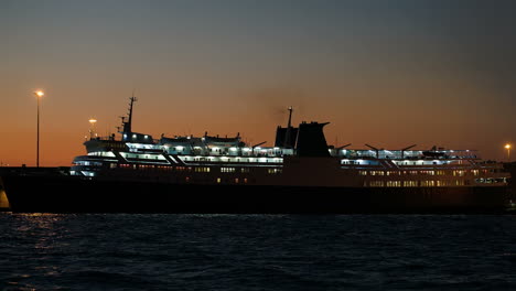 illuminated cruise ship in late evening