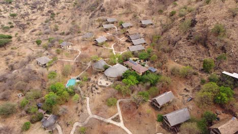 Beautiful-aerial-drone-shot-of-the-Sangaiwe-Tented-Lodge-with-swimming-pool-in-Tarangire-National-Park-in-Tanzania-in-Africa