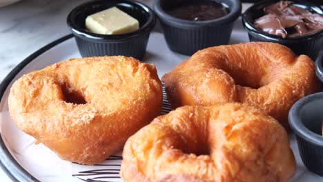 donuts with chocolate and butter toppings