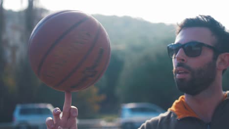 spinning basketball on finger in 4k slow motion 60fps long shot