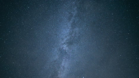 Thick-clouds-in-night-sky-reveal-bright-stars-of-milky-way-nebula-band