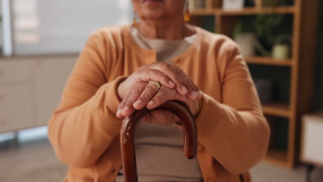 close up of an elderly woman holding a walking cane