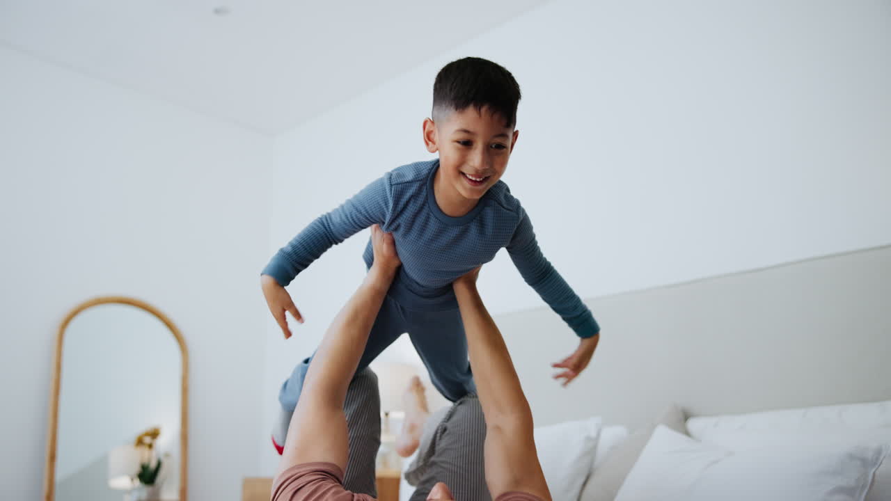 Father and Son Playing in Bedroom