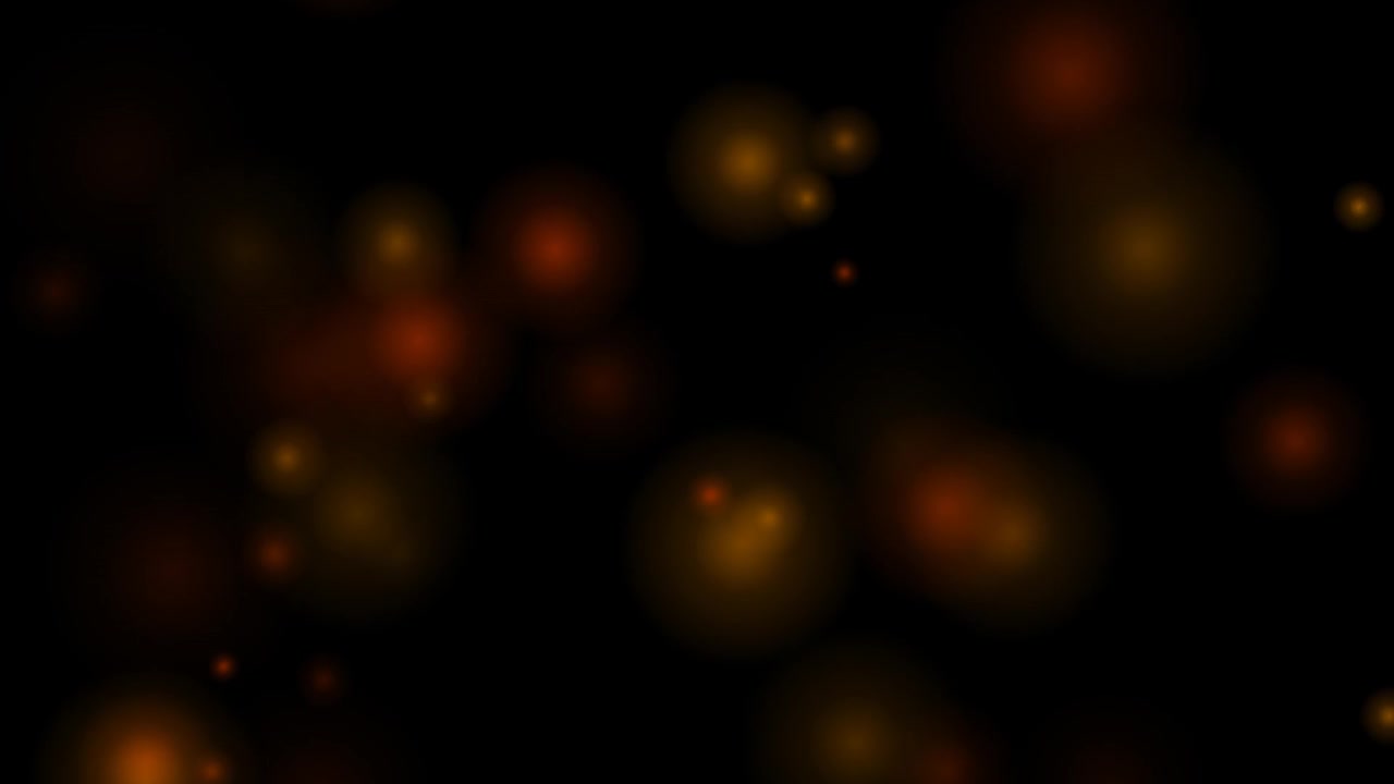 Abstract Golden Bokeh Lights Floating on Black Background