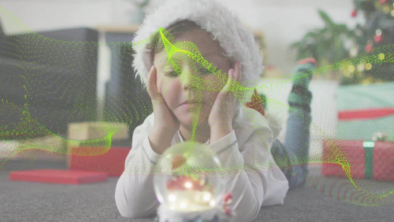 Boy gazing at glowing snow globe activating green waves suggesting holiday marketing magic