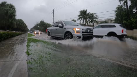 Driving-through-flooded-road-in-slow-motion,-Florida,-USA