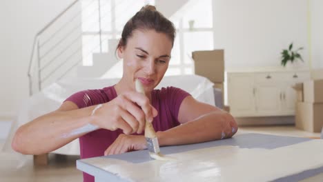 portrait of a caucasian woman in quarantine during coronavirus pandemic, doing interior work