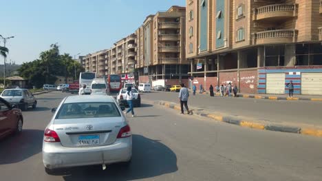 pov driving through city streets into traffic jam/ cairo/ egypt