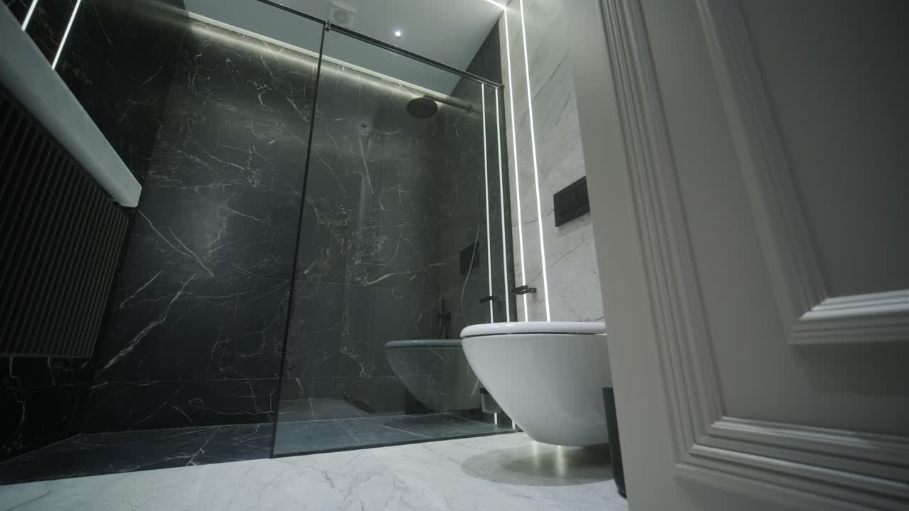 Contemporary Bathroom with Marble Accents and Vertical Lighting