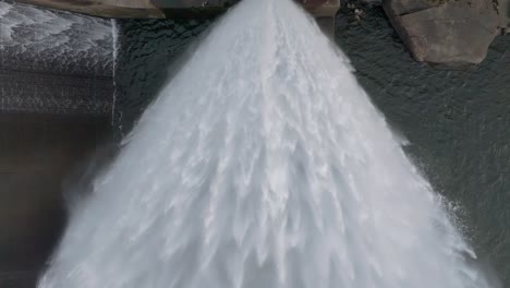 splashing water dam pipeline of presa barrie in negreira, a coruña, spain. slow motion shot
