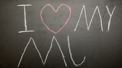 I-love-my-mum-message-appearing-drawn-on-blackboard-with-chalk