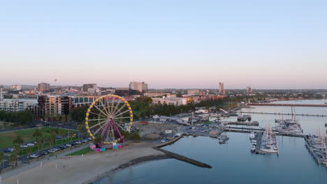 aerial dolly back of beach front city of geelong, australia