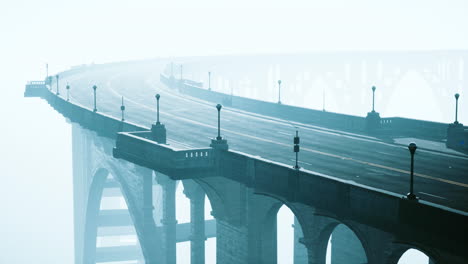 old empty stone bridge on a foggy day