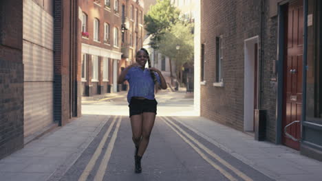 Contemporary-funky-African-American-woman-street-dancer-dancing-freestyle-in-the-city