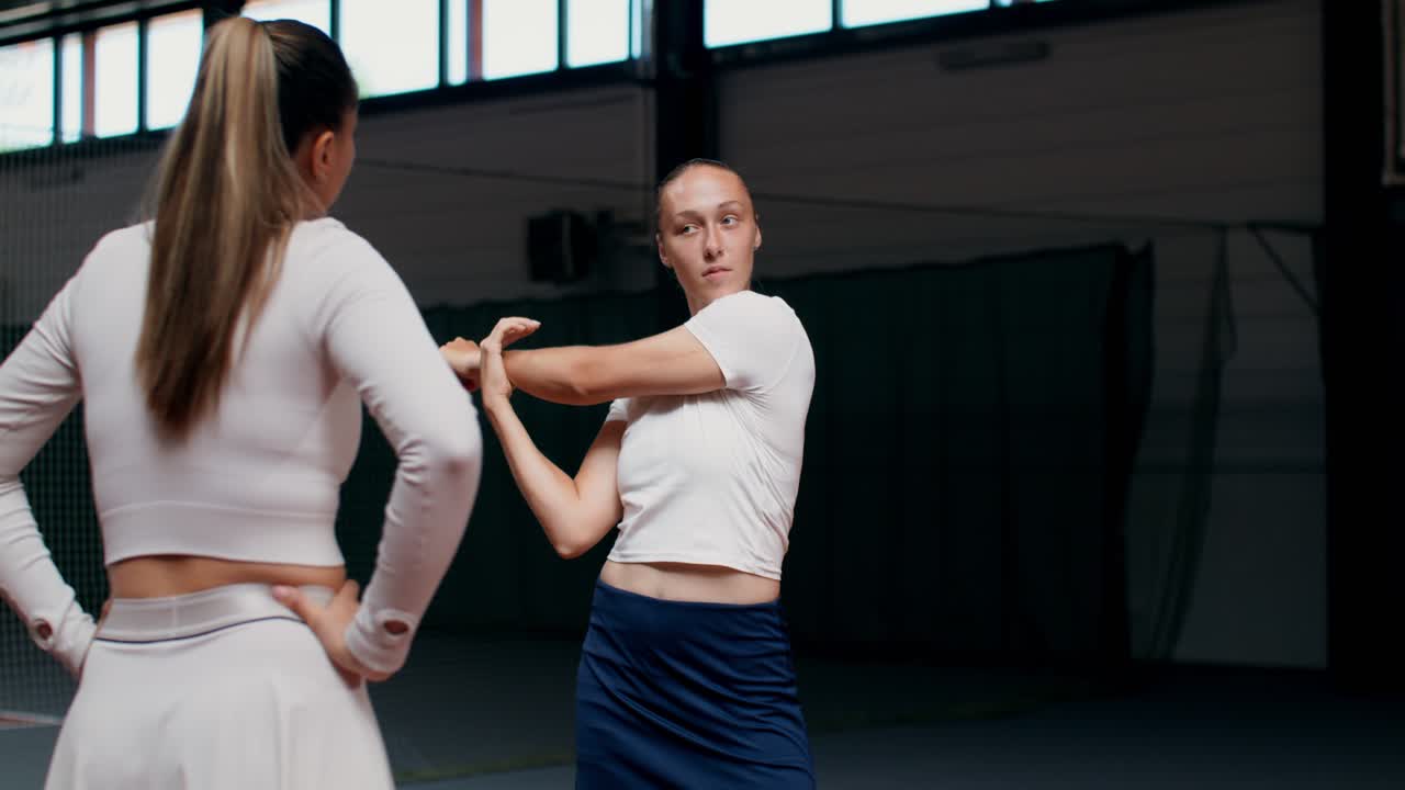 Tennis players stretching before a game