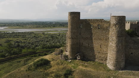 Medieval-Samtsevrisi-castle-walls-on-hill-above-georgian-countryside