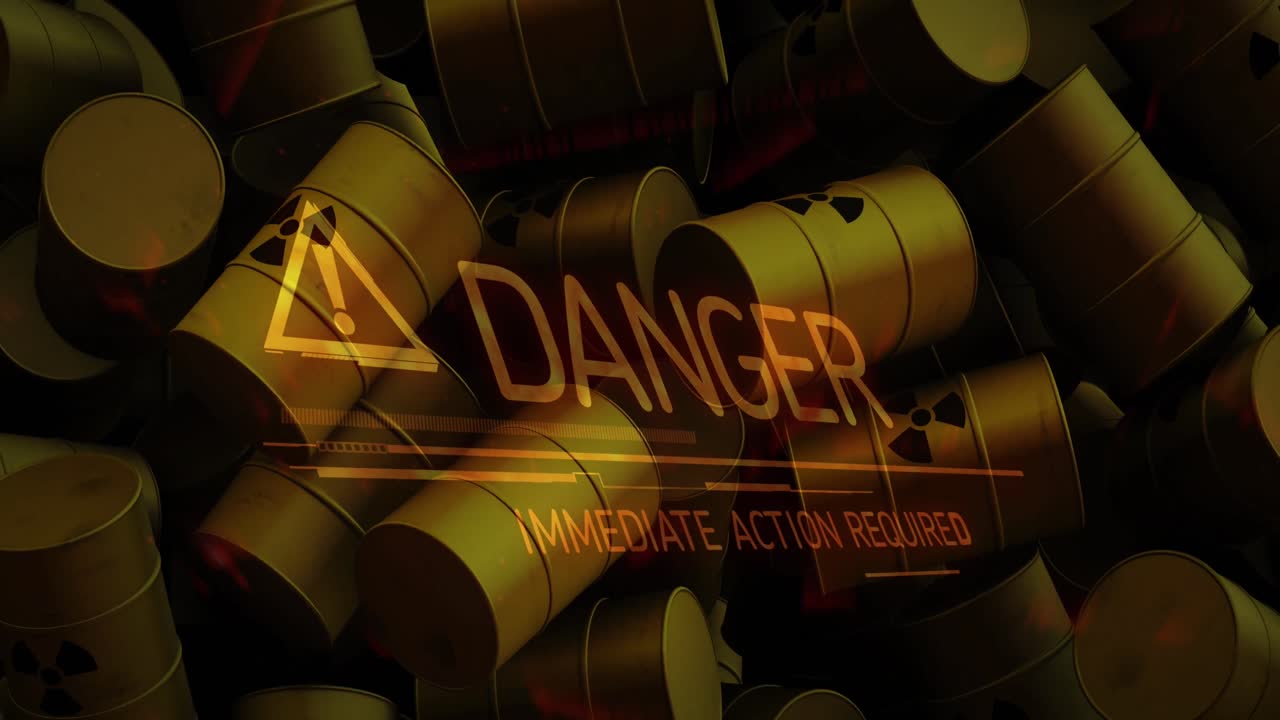 방사능 기호를 가진 배럴 위의 위험 텍스트의 애니메이션