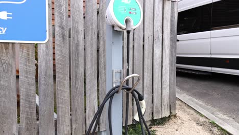 ev charger station with cables and signage