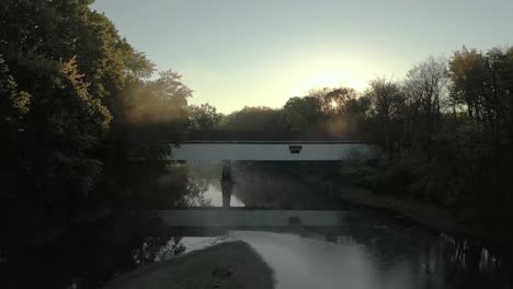 k drone flyover historic covered bridge over river