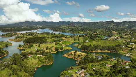 Aerial-tracking-shot-overlooking-nature-of-the-Peñol-Guatapé-Reservoir-in-Colombia