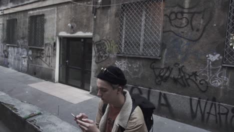 young traveler checks the message on the mobile phone