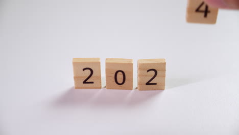 making a countdown for the coming new year 2024 using the numbers etched on wooden tiles