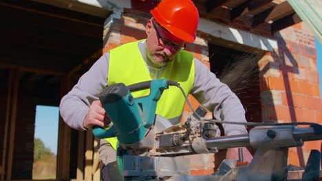 carpenter man using circular electric saw for cutting wooden boards, woodworker at construction site