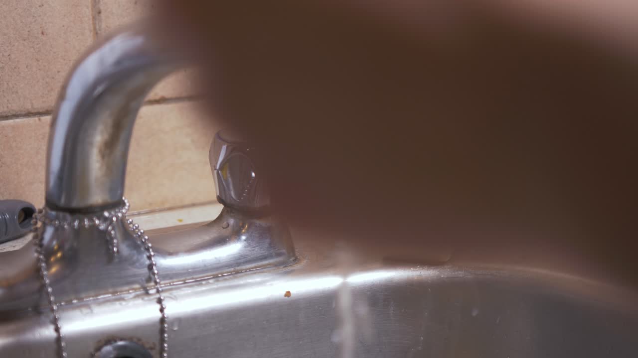 Male hands washing with a bar of soap in slow motion