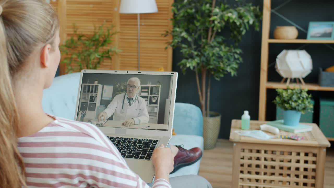 Woman having a video call with her doctor