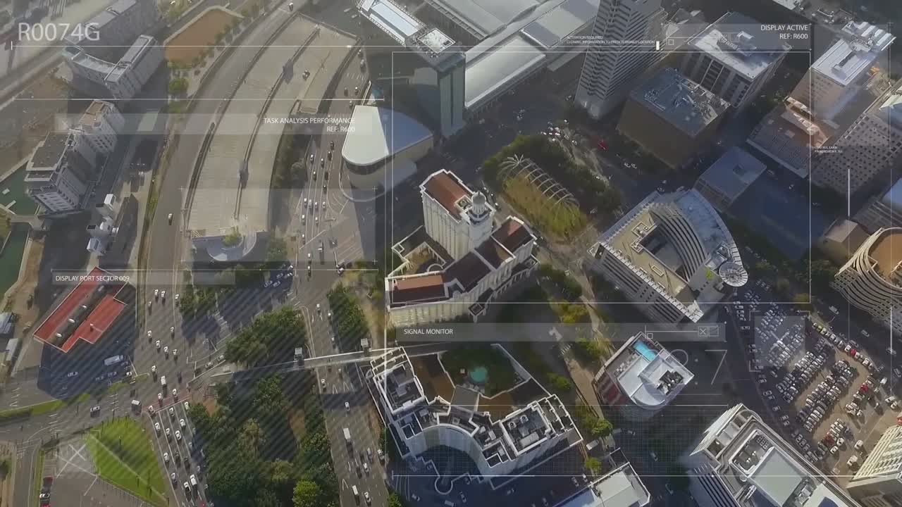animación de textos y líneas que se mueven en formas geométricas sobre una vista aérea de la ciudad moderna.