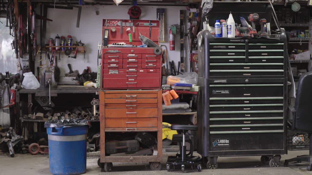 Detailed View of a Mechanic's Workshop with Tools and Storage Cabinets